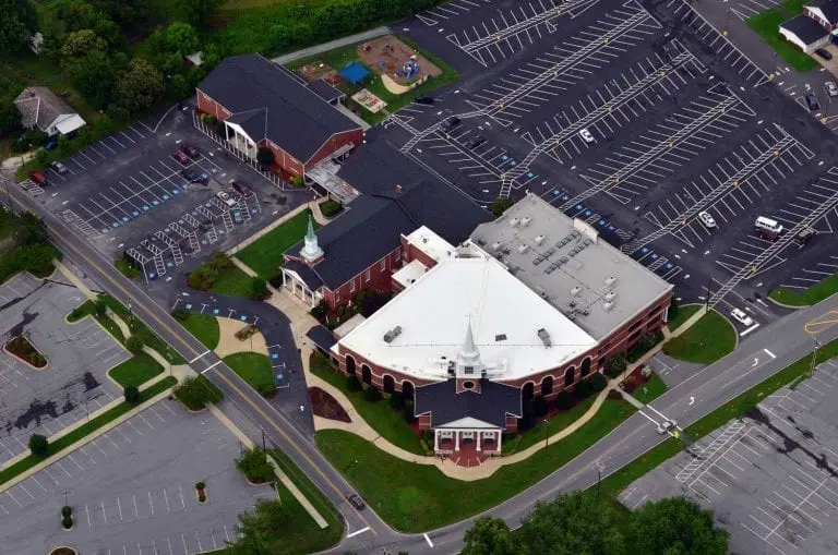 Shingle and low slope roof on church in Hendersonville, NC installed by the southeast's best commercial roofer