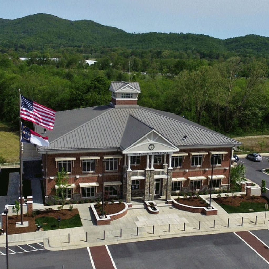 Drone picture of a standing seam metal roof on a town hall