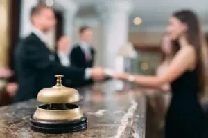 Picture of guests getting key card in hotel