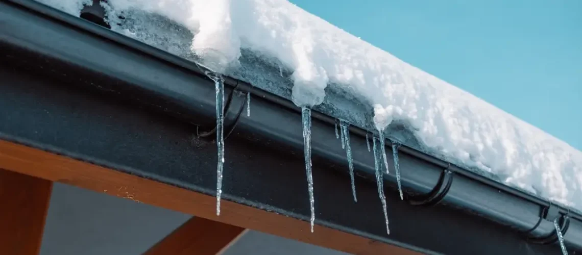 Icicles,Hang,From,The,Roof,Of,A,Log,House,Near